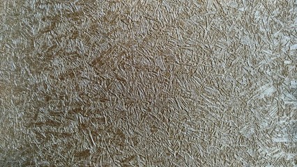 a photo of the pattern and texture of the brown wallpaper that adorns the walls