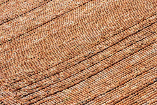 Pantiles. Closeup of a large roof with many tiles made from clay (Coppo, Italian), Metropolitan Cathedral of San Pietro, Bologna, Emilia-Romagna, Italy, Europe