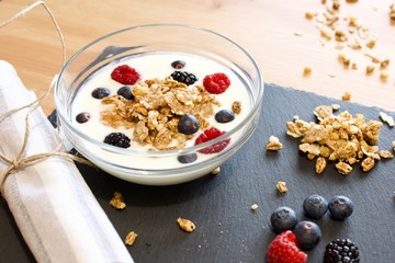 bowl of cereal with blueberries and milk