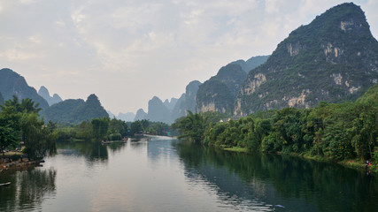 Yulong river flows between a weird mountains in Yangshuo, Guilin, Guangxi Zhuang Autonomous Region in China. It also known as the Little Li River.        