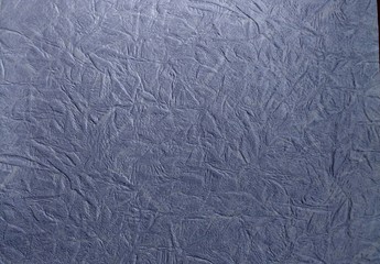 a photo of the pattern and texture of the blue wallpaper that adorns the walls