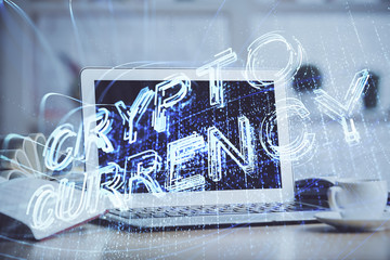 Multi exposure of blockchain and crypto economy theme hologram and table with computer background. Concept of bitcoin cryptocurrency.