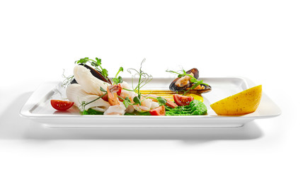 Blanched seafood, cut tomatoes and lemon