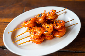 A plate of shrimp grilled on skewer