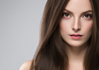 Fototapeta premium Woman face beauty healthy clean skin natural make up brunette hair close up female portrait