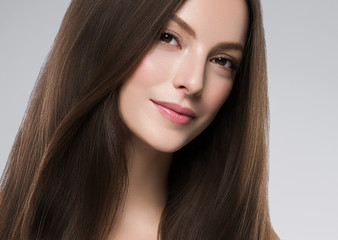 Naklejka premium Woman face beauty healthy clean skin natural make up brunette hair close up female portrait
