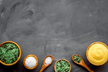 Mineral bath salt on grey background top-down frame copy space