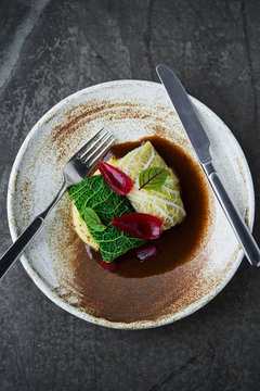 Stewed pork in savoy cabbage leaves with mashed potatoes