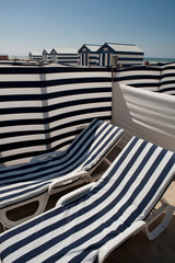 bath cabins and lounge chairs on the beach at De Panne in Belgium
