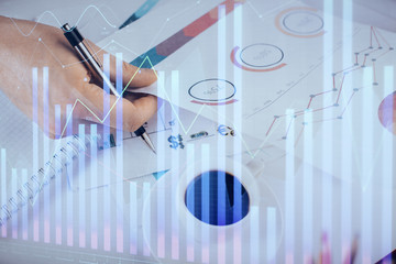 Multi exposure of man planing investment with stock market forex chart.