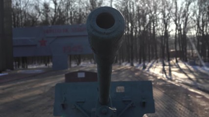 Anti tank gun in military park. Old anti tank cannon monument mounted on pedestal on winter day in military park