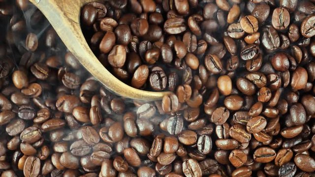 Hot and steaming coffee beans are mixed while roasting