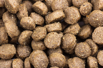 Fototapeta na wymiar Dry food for dog and cat background, close-up, top view