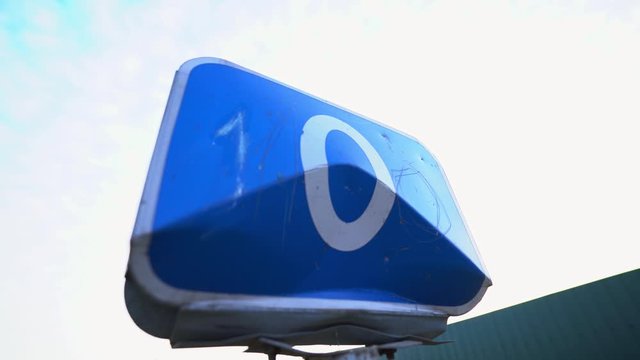 Zero road sign. Zero mile, kilometer. Check Point. Border of two countries. Equator. The beginning of the way. Fence on the cordon. Blue road sign. Traffic Laws. Travels. Tourism. Road for trucker.