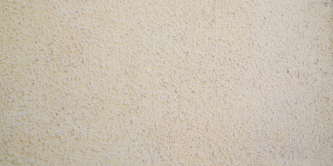 Beige sand plaster wall texture background