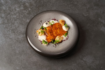 Baked salmon fish fillet with chinese cauliflower and cream sauce