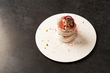 Meringue dessert Pavlova cake with fresh raspberries and whipped cream