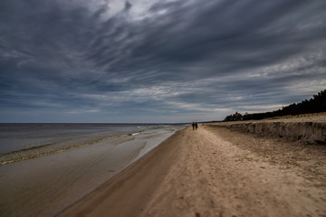 Fototapeta na wymiar calm landscape of the beach on the Polish Baltic Sea on a cloudy February day