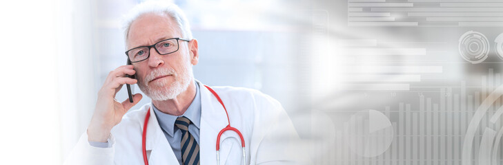 Senior doctor talking on mobile phone; panoramic banner