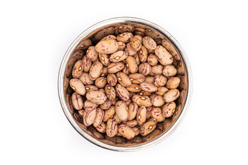 Dried Borlotti Beans from above in a stainless steel bowl, isolated on a white background. Healthy ingredient used in soups and casseroles. Naturally preserved legumes with long shelf life.