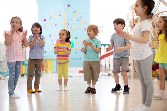 Preschool Kids Group Have Fun Playing At Kindergarden