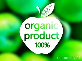 Blurred background of ripe, green apples and a logo with text.