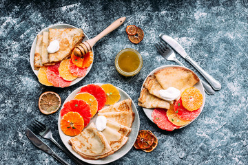 pancakes with citrus on a plate