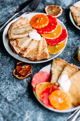 pancakes with citrus on a plate