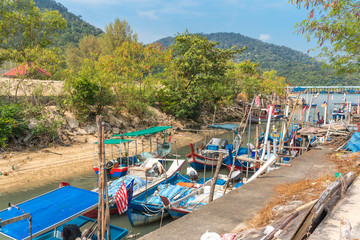 Colorful fishing boats in the harbor of the fishing village Teluk Bahang in the north of the island of Penang