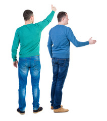 Back view two man in sweater showing thumb up.