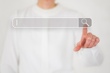 Index finger of a hand points to the search field