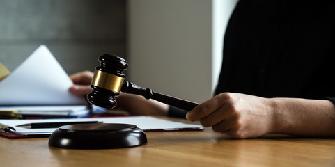 female lawyer working at the law firms. Judge gavel with scales of justice. Legal law, lawyer, advice and justice concept.