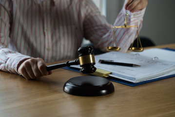 female lawyer working at the law firms. Judge gavel with scales of justice. Legal law, lawyer, advice and justice concept.