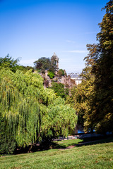 Fototapeta na wymiar Sibyl temple and lake in Buttes-Chaumont Park, Paris