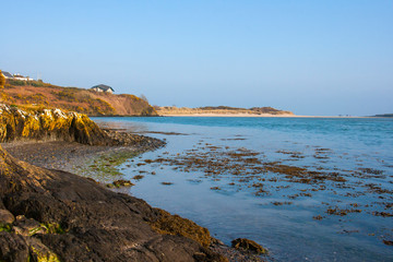 Low tide in a shingle cove at Inchydoney Island