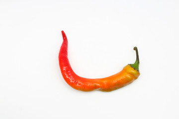 isolated red and yellow chili peppers on a white background.