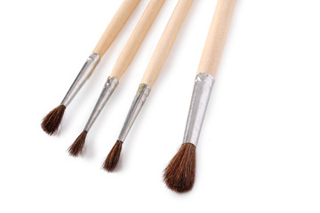 Set of paint brushes on white background