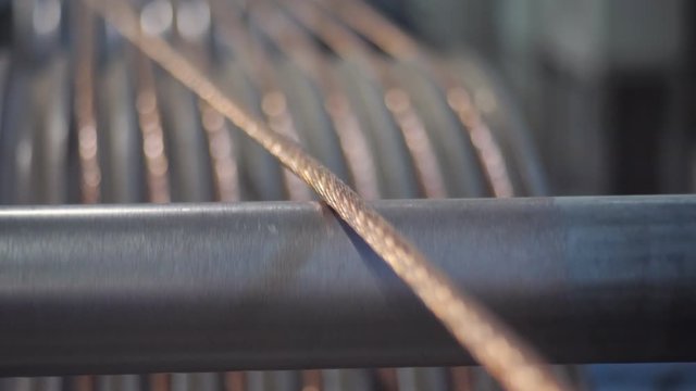 Close-up copper wire comes in rolls for the drawing process at the cable factory.