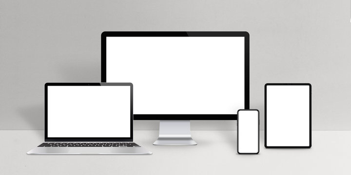 Responsive design devices mockup. Laptop, computer display, phone and tablet with isolated screen on work desk