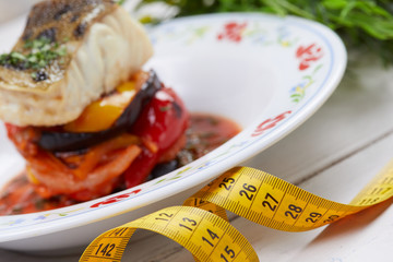 white fish steak with roasted vegetables