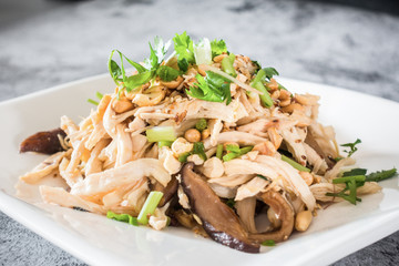 Shredded chicken with cold mix in a white plate