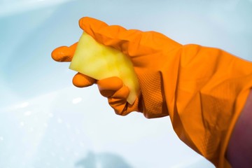 cleaning the bathroom hand in glove