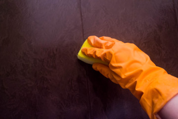 cleaning the bathroom hand in glove