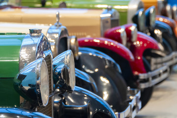 vintage cars standing in a row front