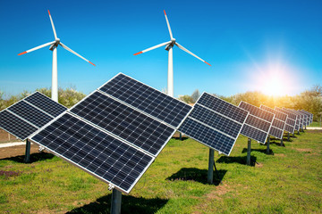 Photo collage of solar panels, photovoltaics, with sun tracking systems and wind turbines -  alternative electricity source, concept of renewable energy sources and sustainable resurses © diyanadimitrova