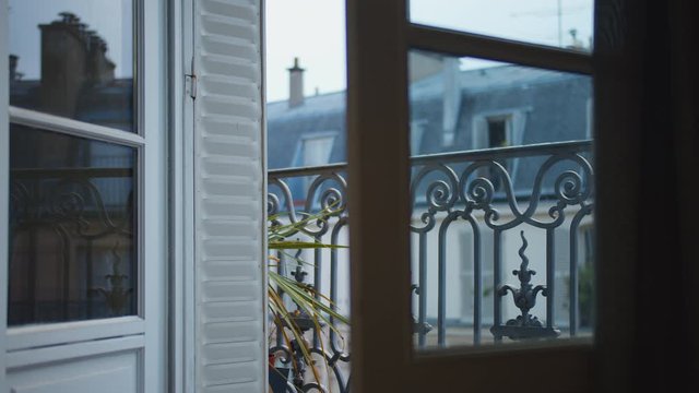 Street view from a french apartment with a balcony