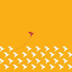Think differently concept. Be different. Red bird changing direction. New idea, change, trend, courage, creative solution, innovation and unique way concept.	