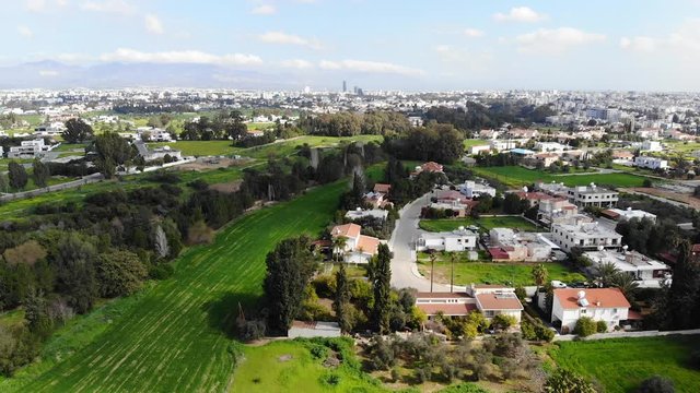 Drone view of Nicosia capital city and green parks, Cyprus