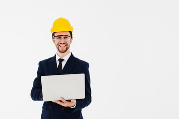 Young architect wearing glasses and safety helmet.