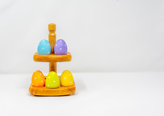 Easter Eggs on a rack with a white background